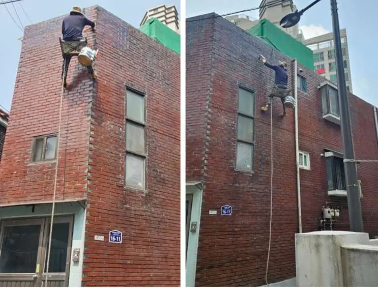 대림동 다세대주택 외벽에 로프로 접근하는 작업자